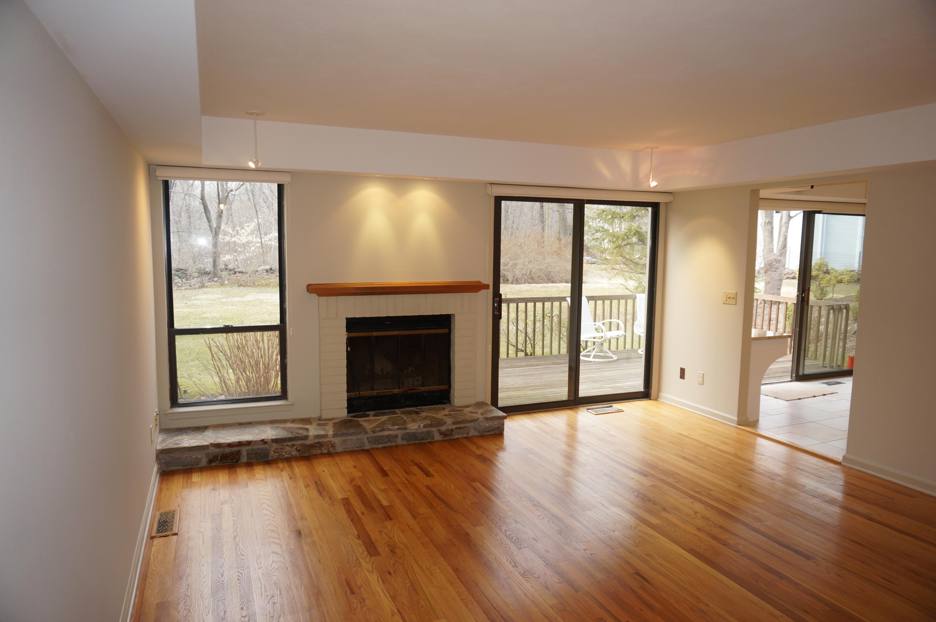 500 River Road, Unit 7 Greenwich, CT 06807 - Photo 6 of 29 wooden floor fireplace and natural light in room