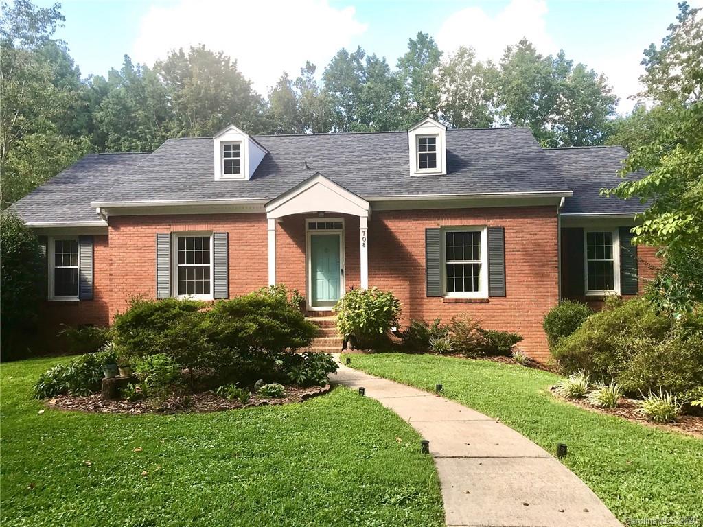 708 Trail Ridge Road Matthews, NC 28105 - Photo 1 of 40 a front view of a house with a yard