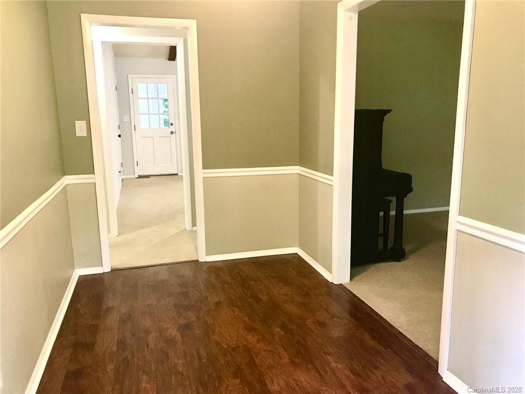 708 Trail Ridge Road Matthews, NC 28105 - Photo 2 of 40 a view of a hallway with wooden floor