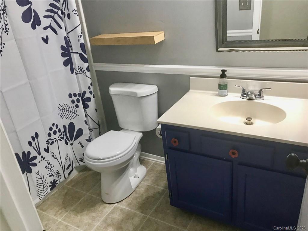 708 Trail Ridge Road Matthews, NC 28105 - Photo 21 of 40 a bathroom with a toilet sink and mirror