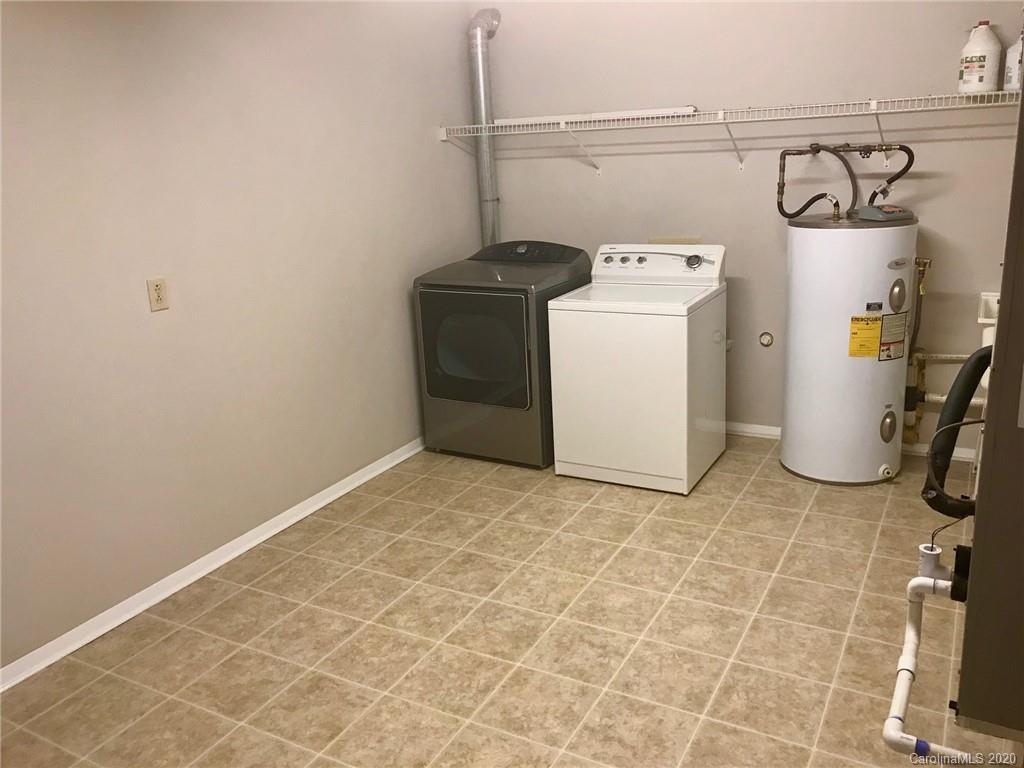 708 Trail Ridge Road Matthews, NC 28105 - Photo 27 of 40 a utility room with a washing machine
