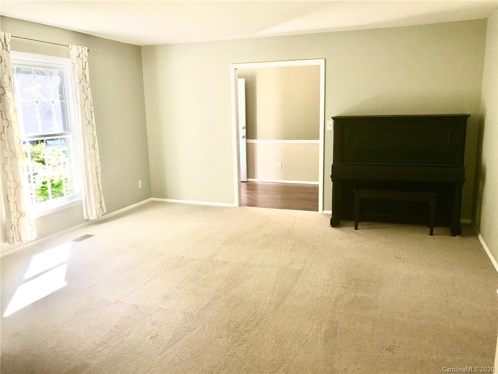 708 Trail Ridge Road Matthews, NC 28105 - Photo 4 of 40 a view of an empty room with a window
