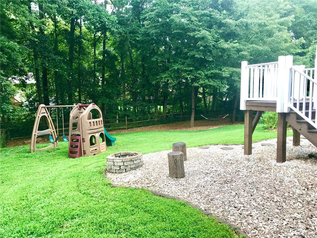 708 Trail Ridge Road Matthews, NC 28105 - Photo 36 of 40 a view of a house with backyard and a slide