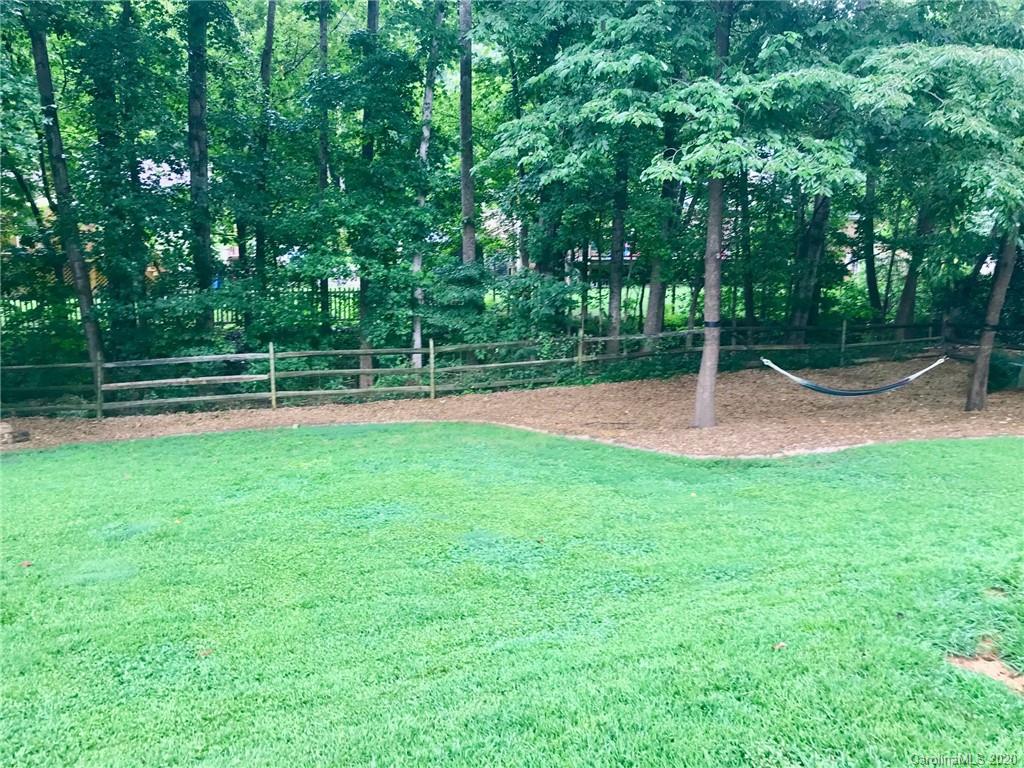 708 Trail Ridge Road Matthews, NC 28105 - Photo 37 of 40 a backyard of a house with lots of green space