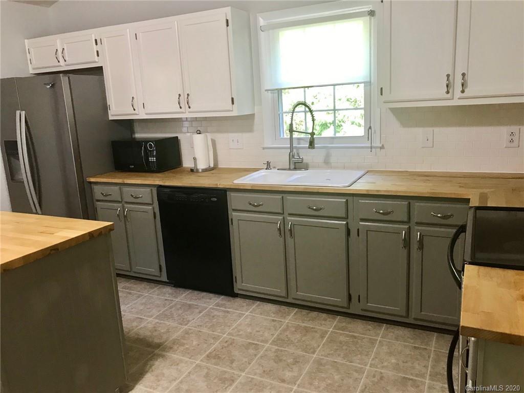 708 Trail Ridge Road Matthews, NC 28105 - Photo 9 of 40 a kitchen with stainless steel appliances granite countertop a refrigerator sink and cabinets