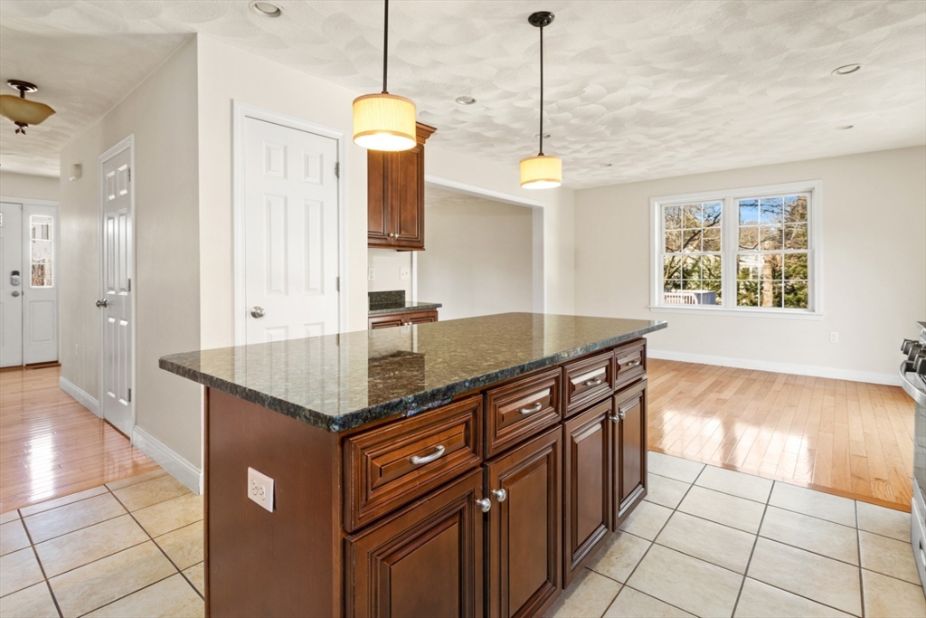 3 Gordon Road North Reading, MA 01864 - Photo 16 of 38 a kitchen with stainless steel appliances granite countertop a stove and a center island