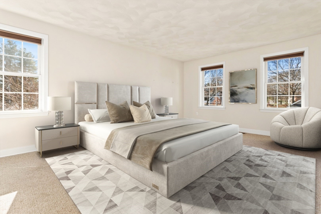 3 Gordon Road North Reading, MA 01864 - Photo 22 of 38 a bedroom with a large bed and a couch