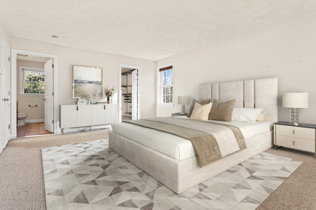 3 Gordon Road North Reading, MA 01864 - Photo 23 of 38 a spacious bedroom with a large bed and a couch