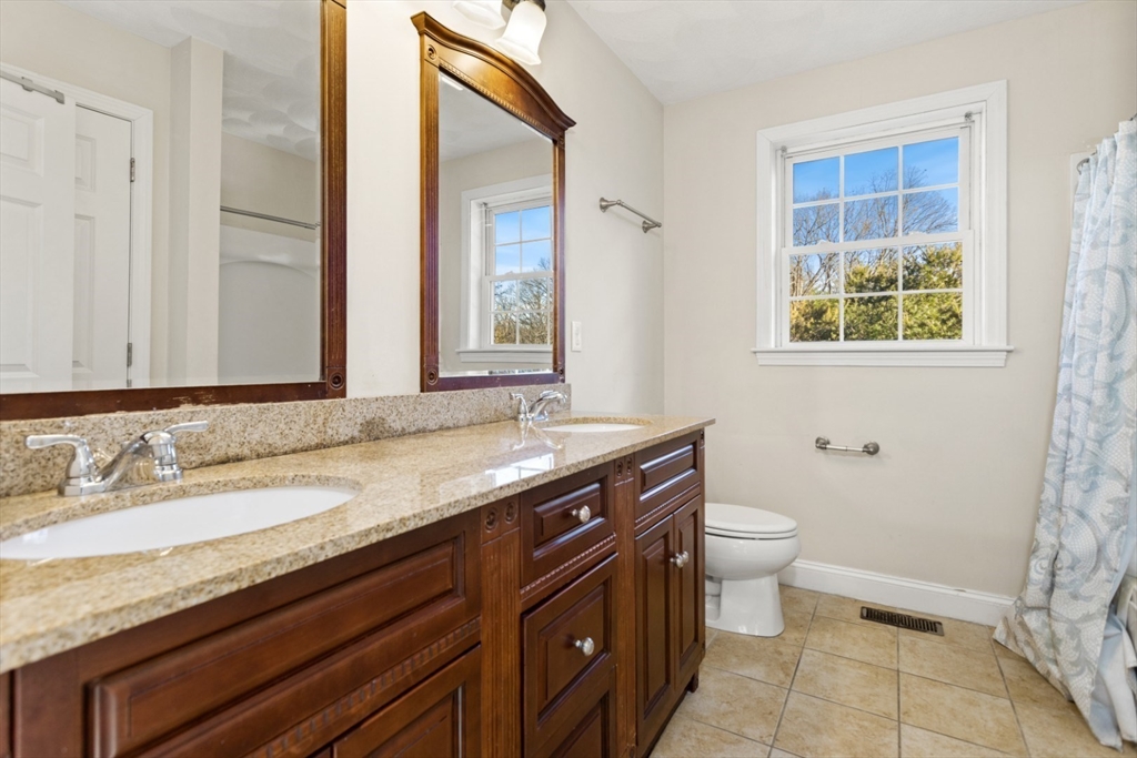 3 Gordon Road North Reading, MA 01864 - Photo 25 of 38 a bathroom with a granite countertop sink toilet and mirror