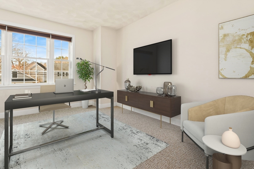 3 Gordon Road North Reading, MA 01864 - Photo 26 of 38 a living room with furniture and a flat screen tv