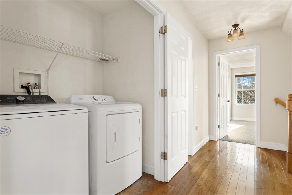 3 Gordon Road North Reading, MA 01864 - Photo 28 of 38 a view of a storage & utility room with dryer and washer