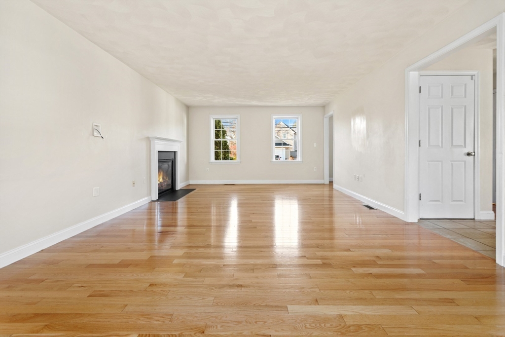 3 Gordon Road North Reading, MA 01864 - Photo 7 of 38 a view of empty room with wooden floor and fan