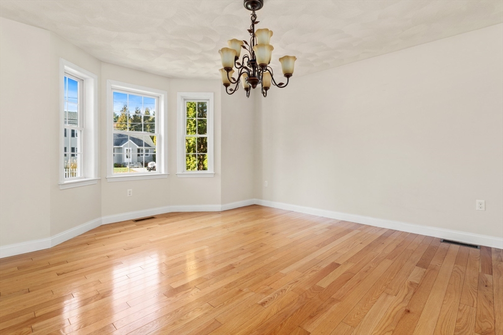 3 Gordon Road North Reading, MA 01864 - Photo 10 of 38 a view of an empty room with wooden floor and a window