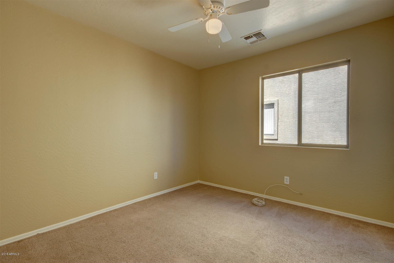 8445 West Riley Road Tolleson, AZ 85353 - Photo 15 of 23 Bedroom 2