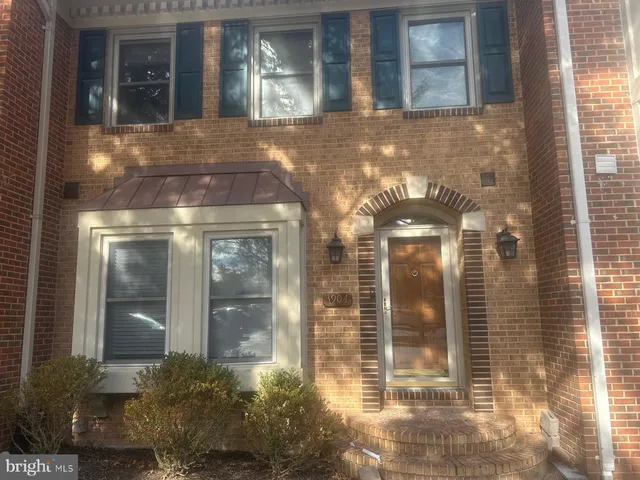 a view of a brick house with a entrance