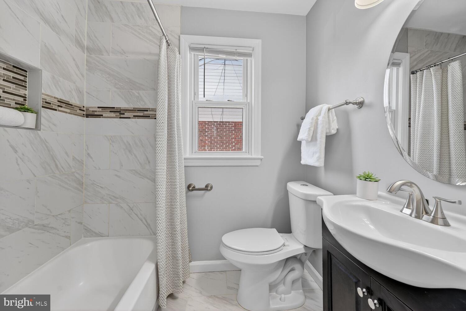 3433 25th Street Southeast Washington, DC 20020 - Photo 13 of 26 a bathroom with a sink toilet and shower