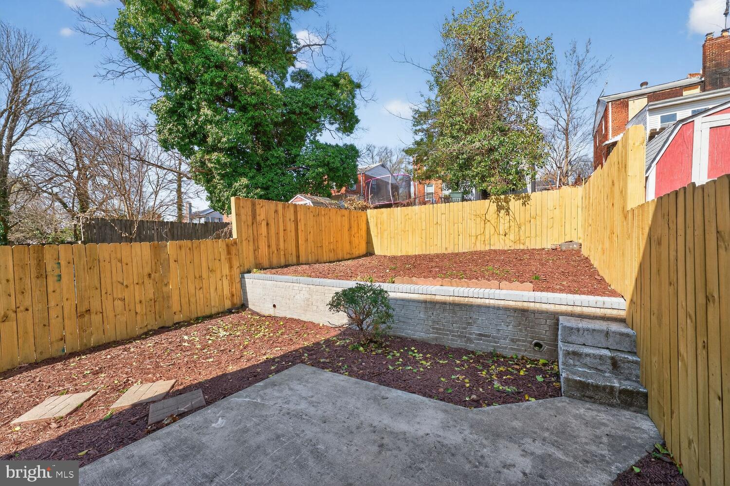 3433 25th Street Southeast Washington, DC 20020 - Photo 22 of 26 a view of a backyard with a tree