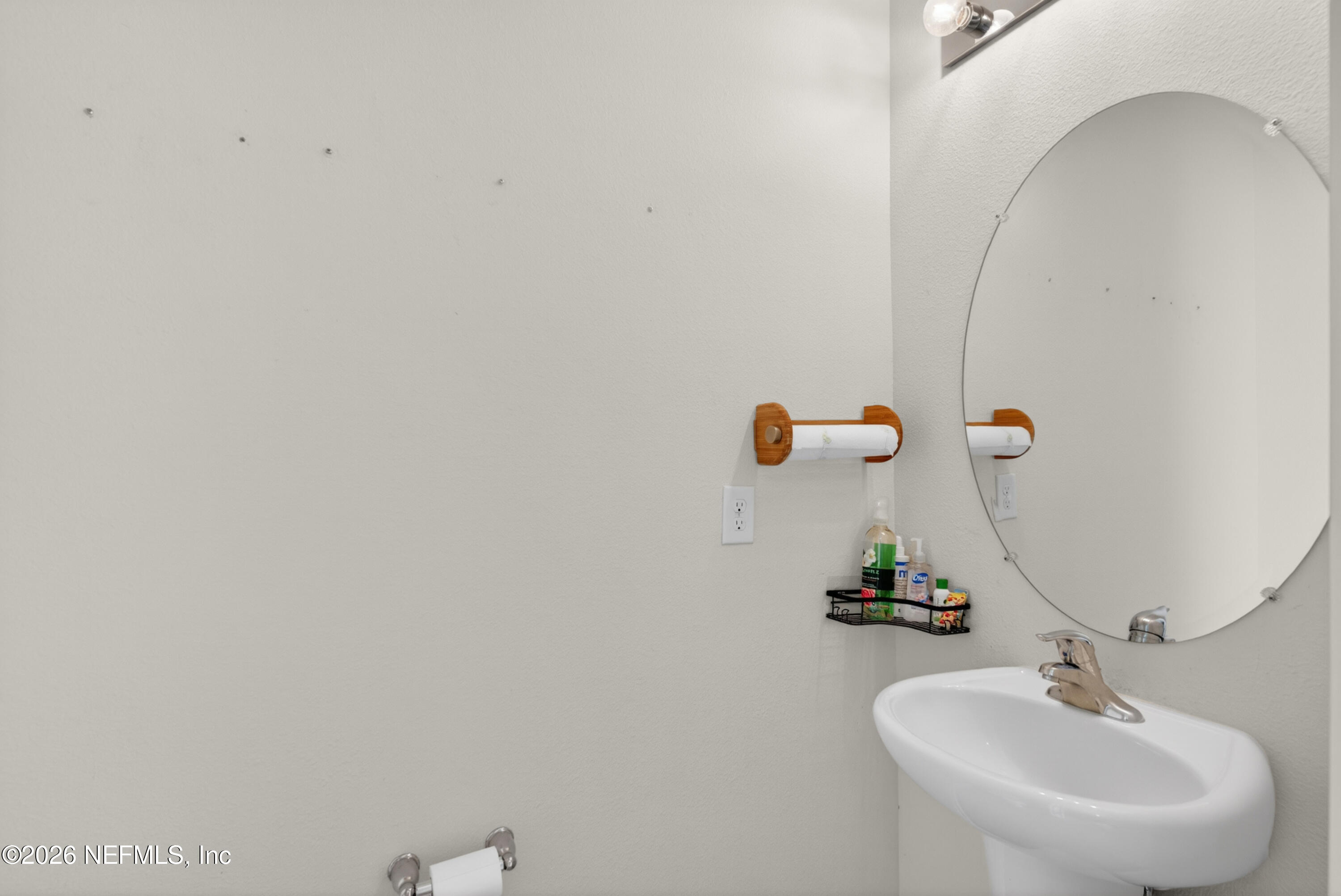 8210 Larose Road Jacksonville, FL 32211 - Photo 14 of 38 a bathroom with a sink and mirror
