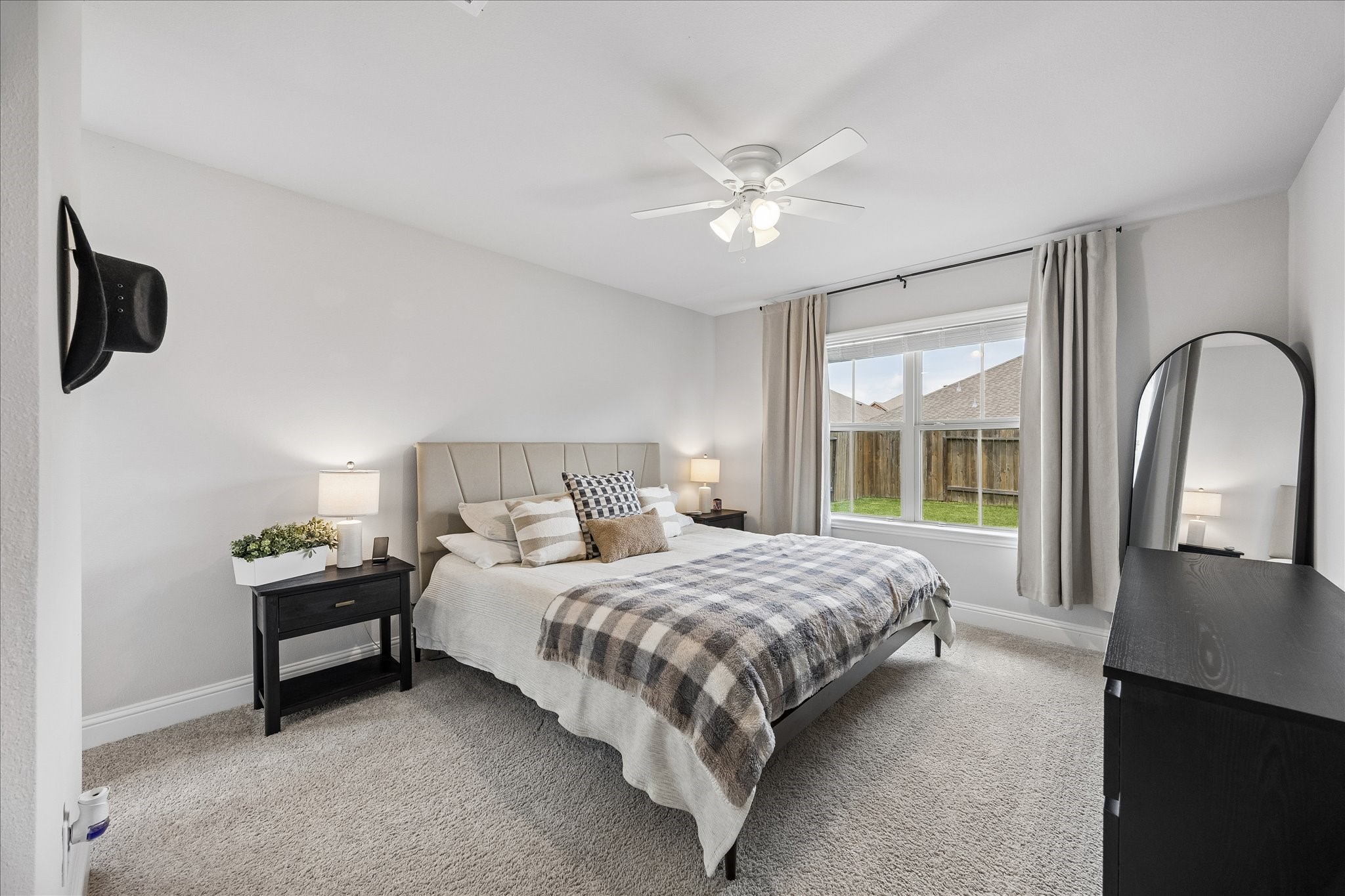 10227 Whitney Reach Drive Rosharon, TX 77583 - Photo 26 of 28 Back very spacious private suite with large window and ceiling fan for year round comfort. This large bedroom has a private entrance to a full bath.