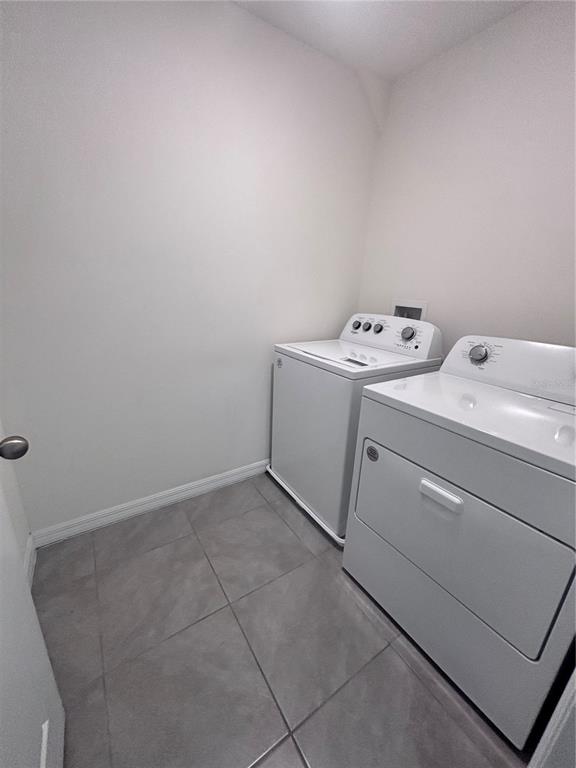 6730 Southeast 3rd Loop Ocala, FL 34472 - Photo 12 of 16 a utility room with dryer and washer