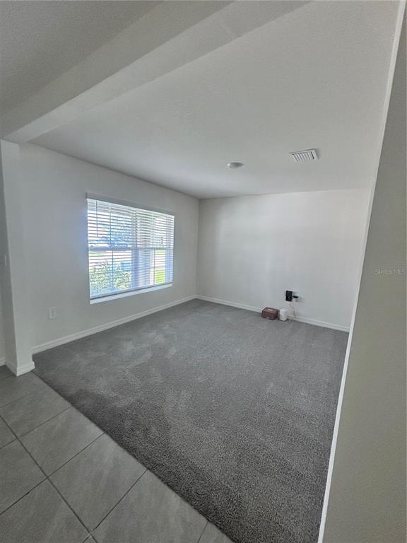 6730 Southeast 3rd Loop Ocala, FL 34472 - Photo 2 of 16 an empty room with a window
