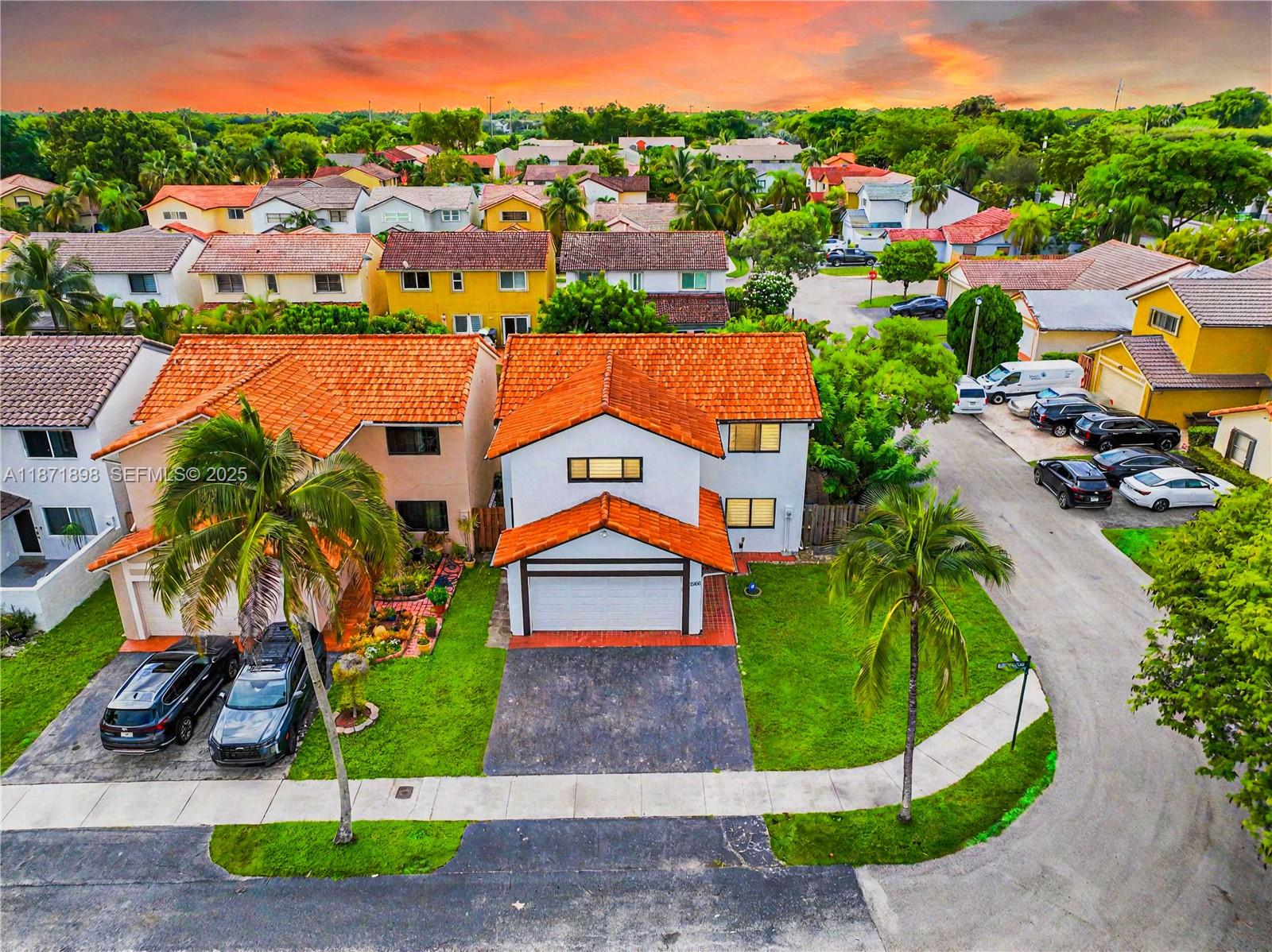 15166 Southwest 94th Terrace Miami, FL 33196 - Photo 2 of 83 an aerial view of residential houses with outdoor space and trees