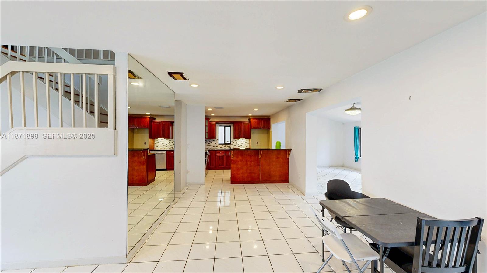 15166 Southwest 94th Terrace Miami, FL 33196 - Photo 21 of 83 a open kitchen with stainless steel appliances kitchen island granite countertop a refrigerator and a sink