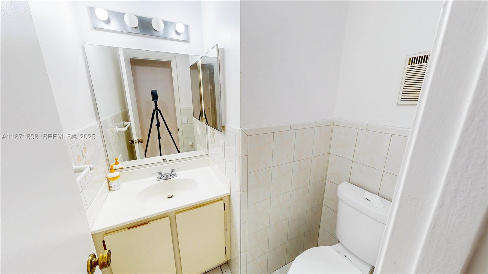 15166 Southwest 94th Terrace Miami, FL 33196 - Photo 30 of 83 a bathroom with a sink and a mirror
