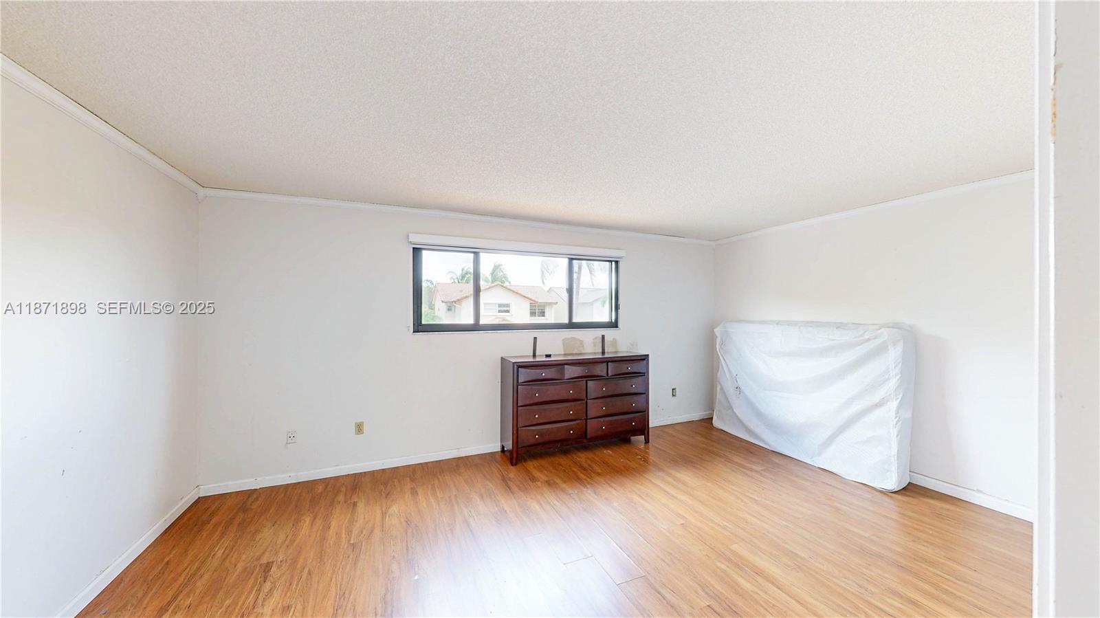 15166 Southwest 94th Terrace Miami, FL 33196 - Photo 36 of 83 an empty room with wooden floor and windows