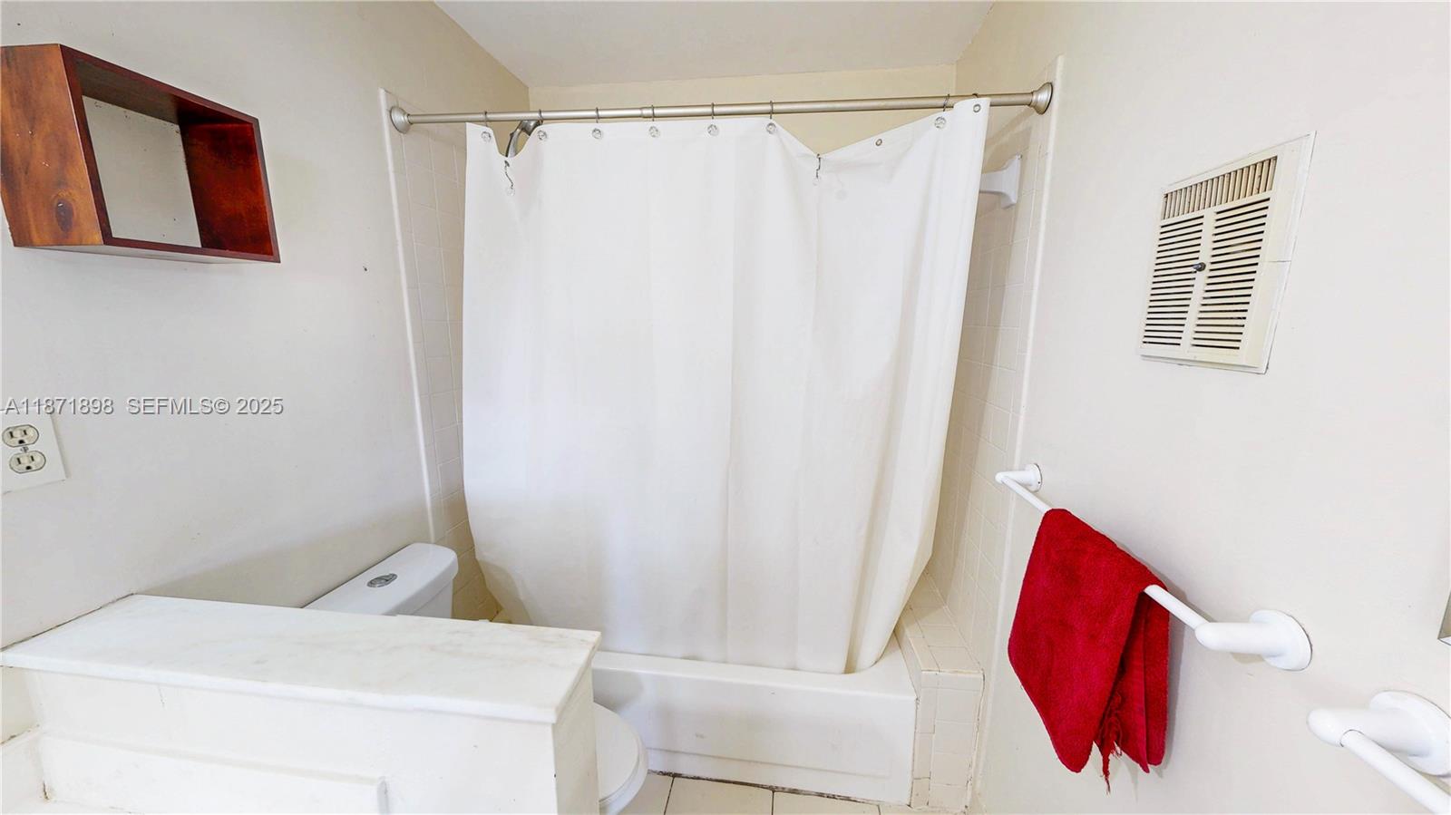 15166 Southwest 94th Terrace Miami, FL 33196 - Photo 44 of 83 a bathroom with a shower curtain and sink