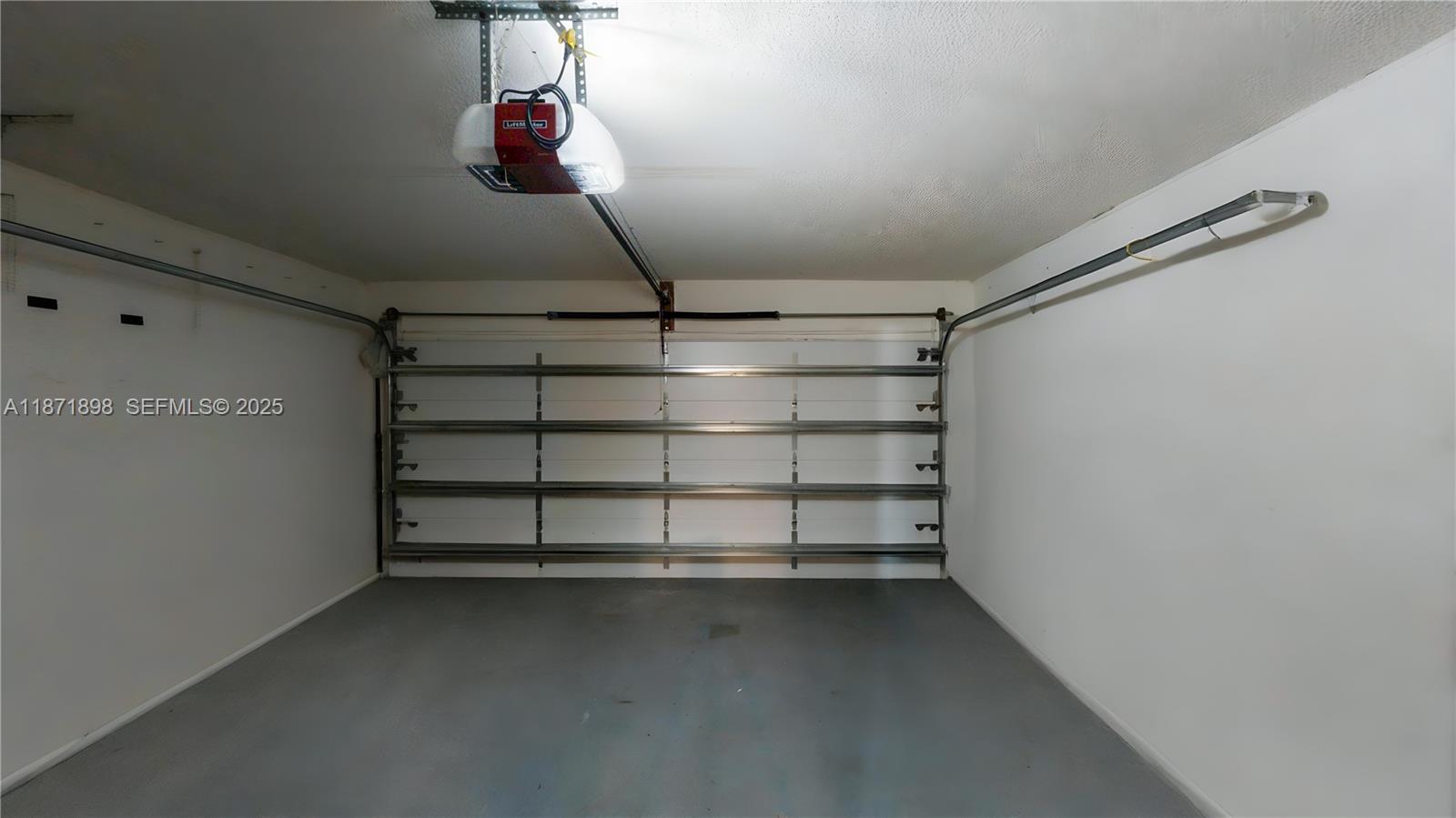 15166 Southwest 94th Terrace Miami, FL 33196 - Photo 53 of 83 a view of a store room with racks on the wall