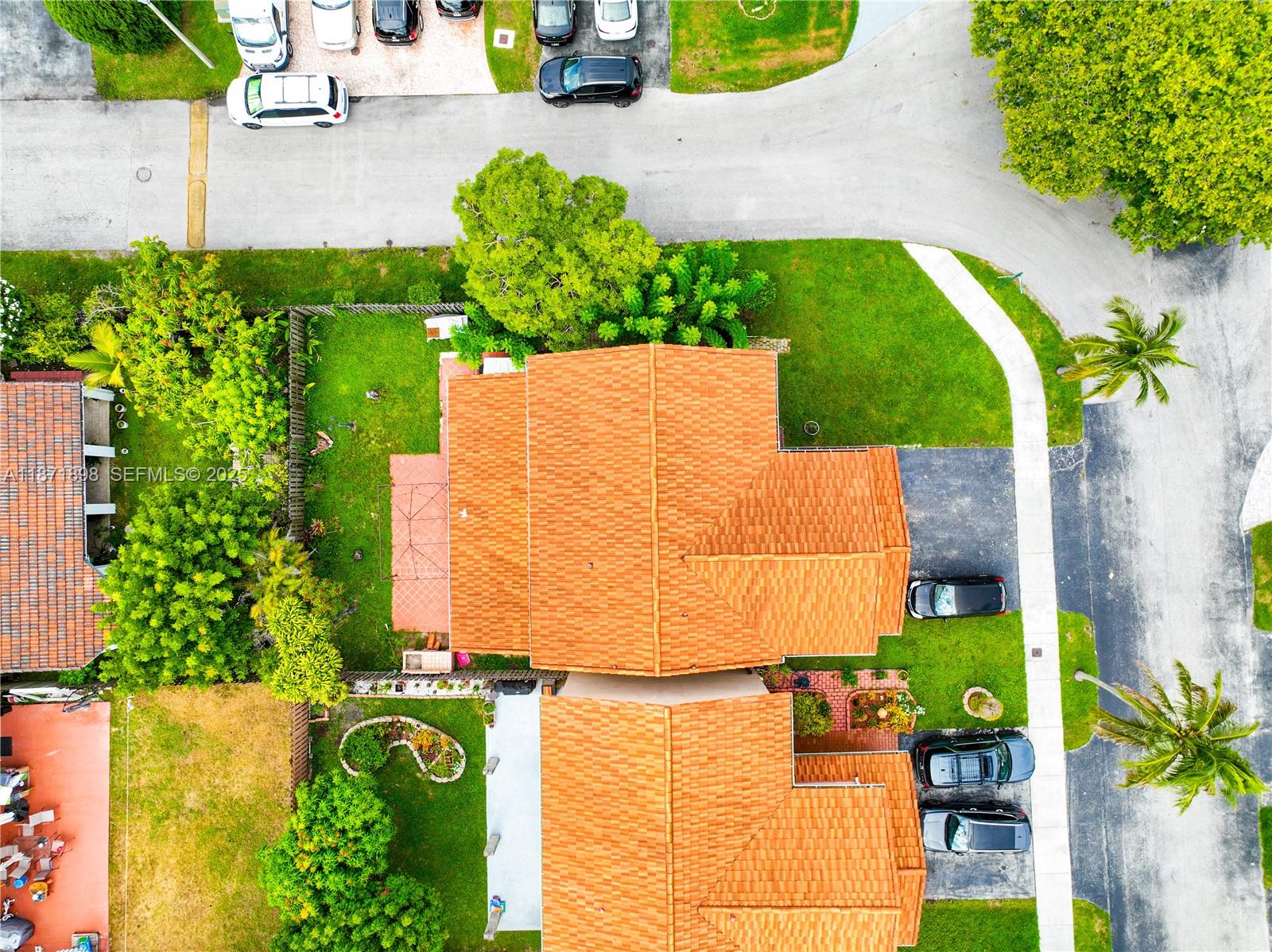 15166 Southwest 94th Terrace Miami, FL 33196 - Photo 68 of 83 an aerial view of a house with a yard and potted plants