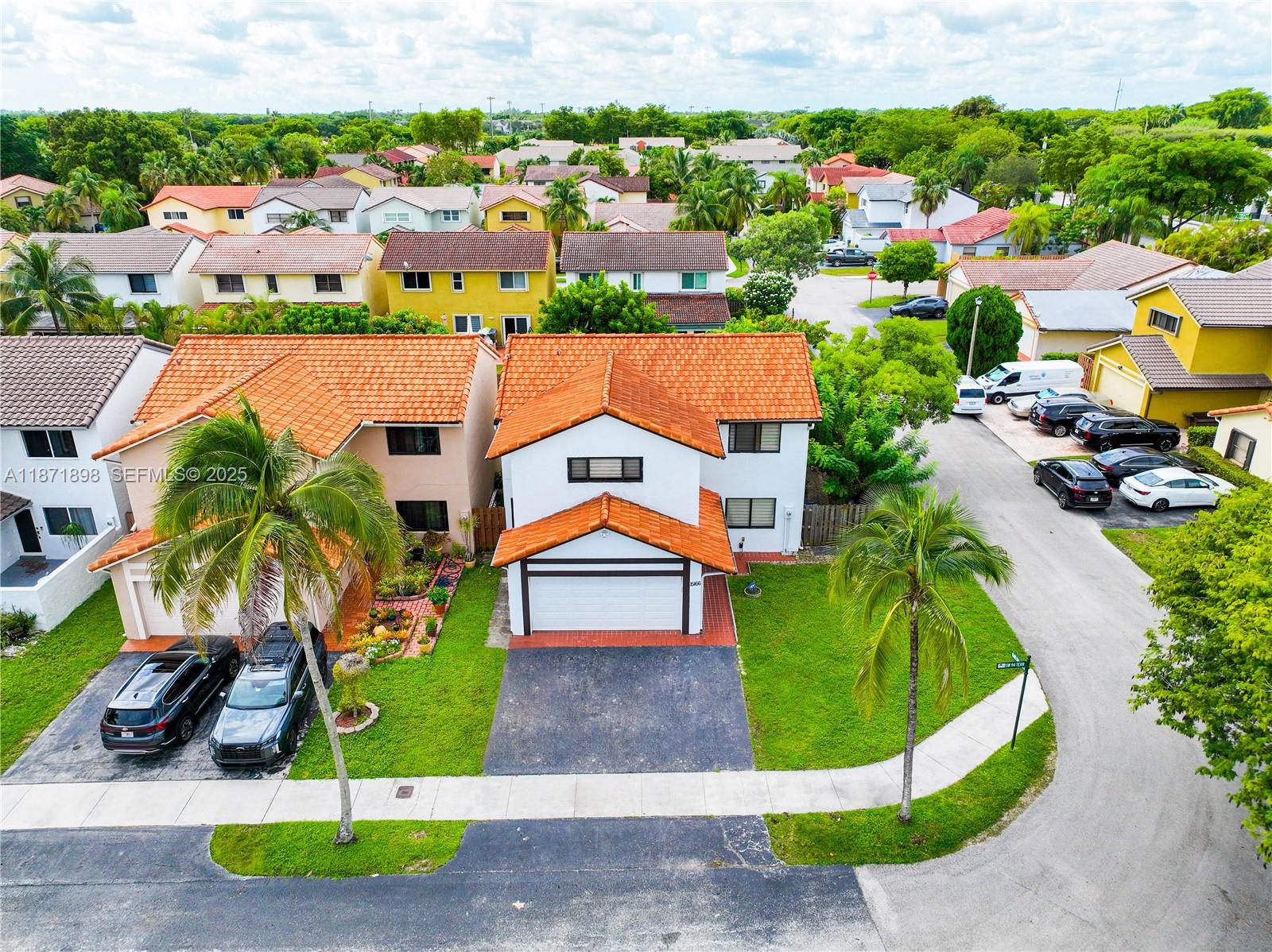 15166 Southwest 94th Terrace Miami, FL 33196 - Photo 70 of 83 an aerial view of a house with a yard and outdoor seating