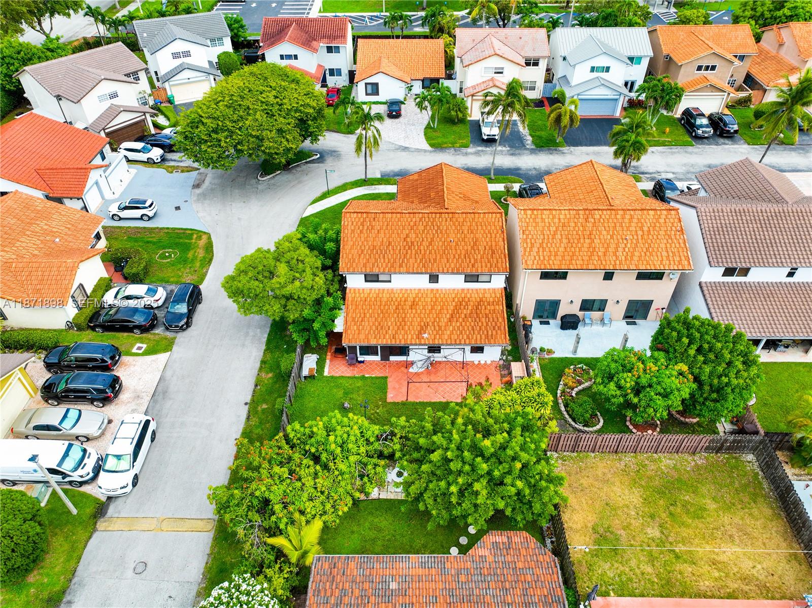 15166 Southwest 94th Terrace Miami, FL 33196 - Photo 71 of 83 an aerial view of a house with a swimming pool yard and outdoor seating