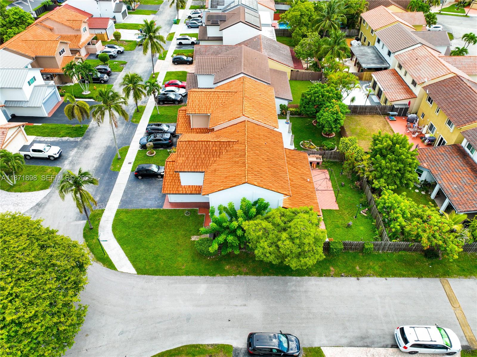 15166 Southwest 94th Terrace Miami, FL 33196 - Photo 72 of 83 an aerial view of a house with a yard and a large tree