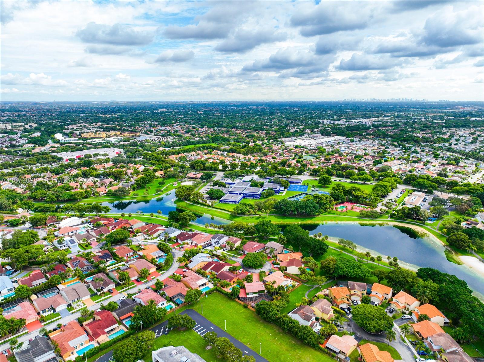 15166 Southwest 94th Terrace Miami, FL 33196 - Photo 82 of 83 an aerial view of residential houses with outdoor space