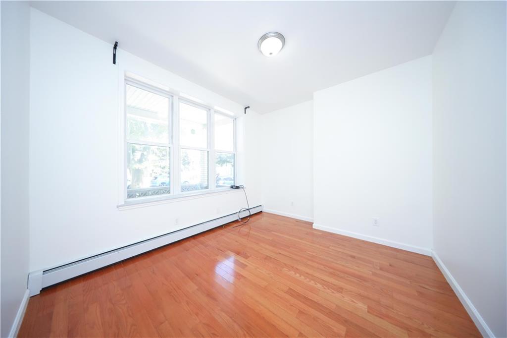 522 81 Street Brooklyn, NY 11209 - Photo 11 of 42 a view of an empty room with a window