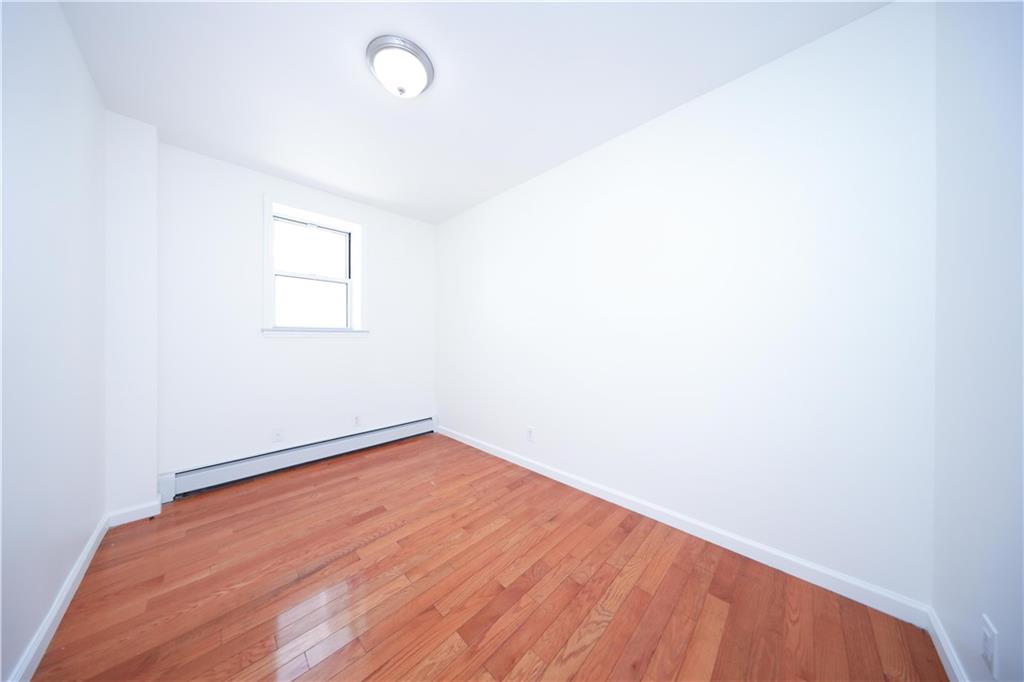 522 81 Street Brooklyn, NY 11209 - Photo 12 of 42 a view of an empty room with a window