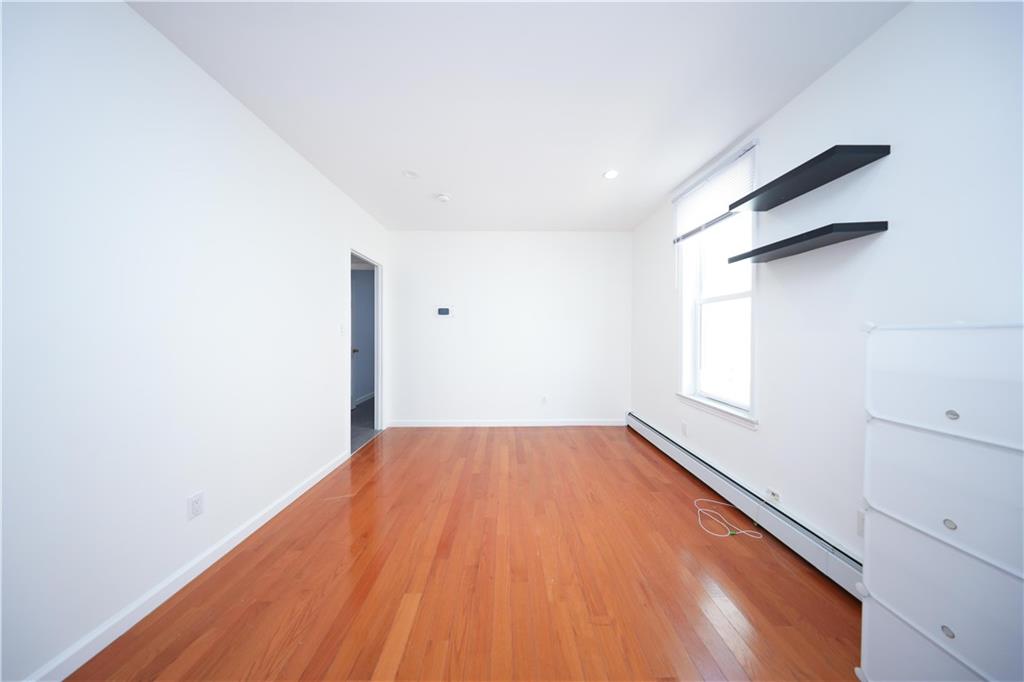 522 81 Street Brooklyn, NY 11209 - Photo 30 of 42 a view of a room with wooden floor and cabinet