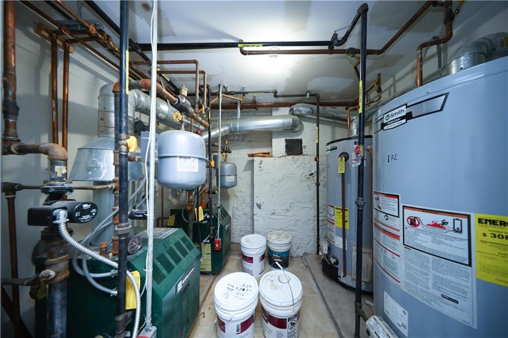 522 81 Street Brooklyn, NY 11209 - Photo 34 of 42 a bathroom with a toilet and a shower