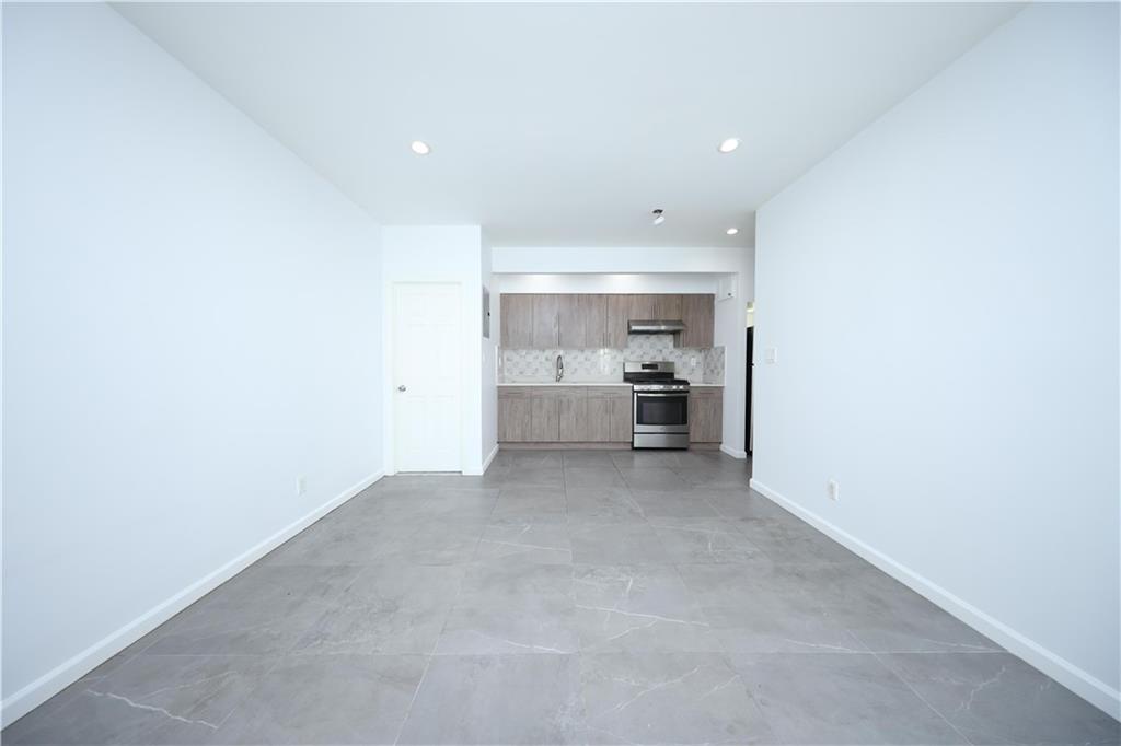 522 81 Street Brooklyn, NY 11209 - Photo 9 of 42 a view of a kitchen with a sink and a refrigerator