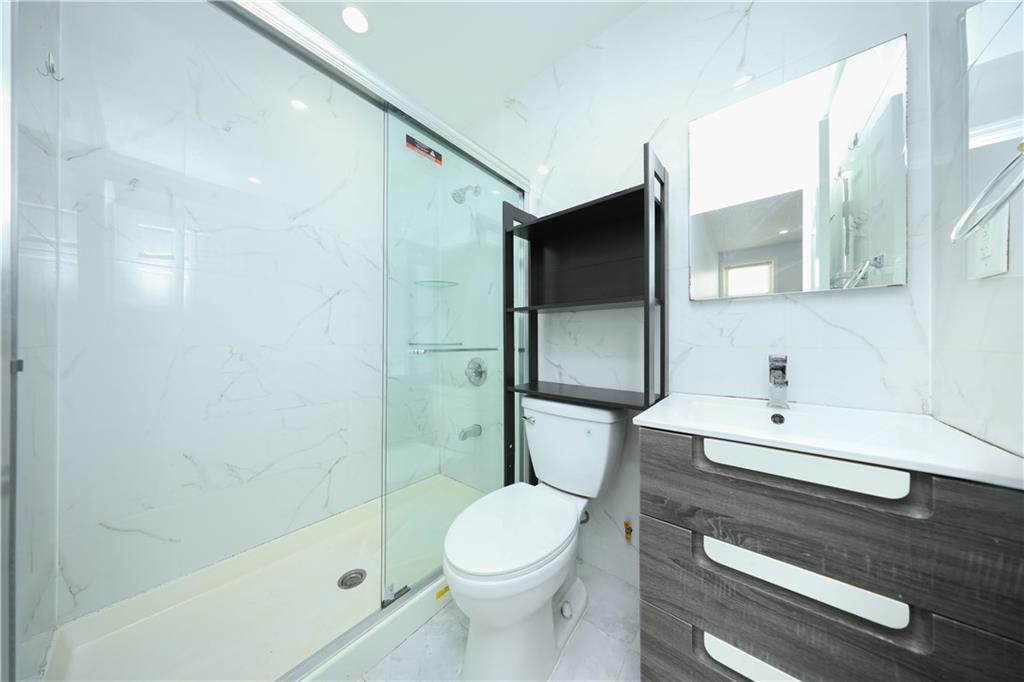 522 81 Street Brooklyn, NY 11209 - Photo 10 of 42 a bathroom with a sink a toilet and shower