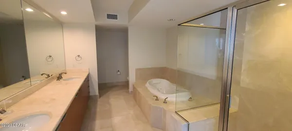 a bedroom with bed and a window