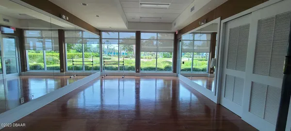 a living room with patio area and garden view