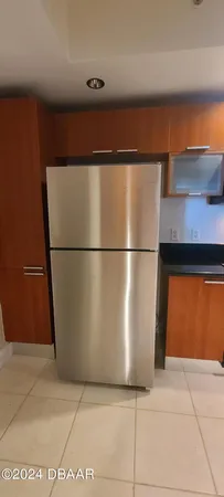 a view of a dining room with furniture and a floor to ceiling window