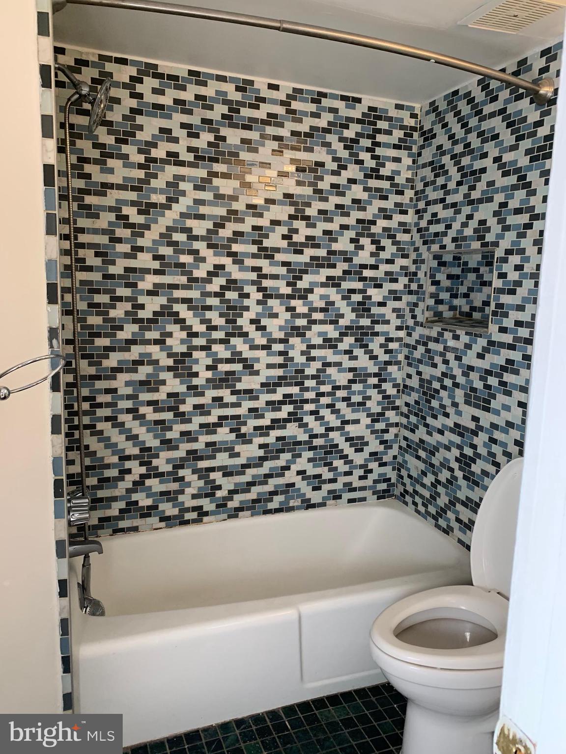 2018 Waverly Street Philadelphia, PA 19146 - Photo 19 of 22 a bathroom with a bathtub and a toilet