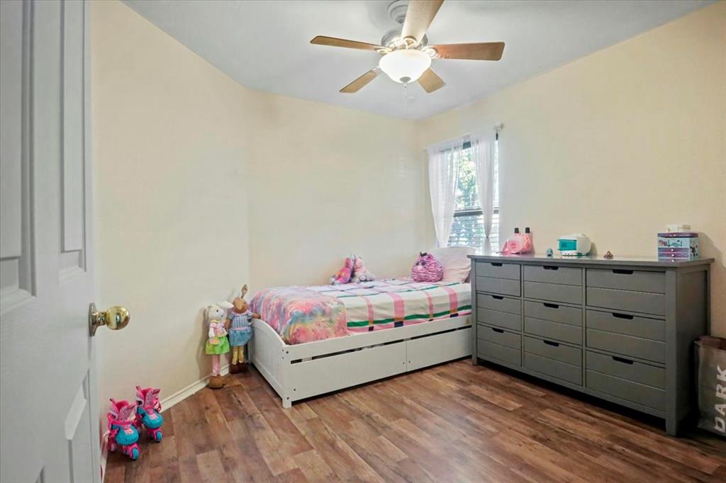 1412 Cheyenne Road Wylie, TX 75098 - Photo 16 of 24 a bed room with a bed and a window