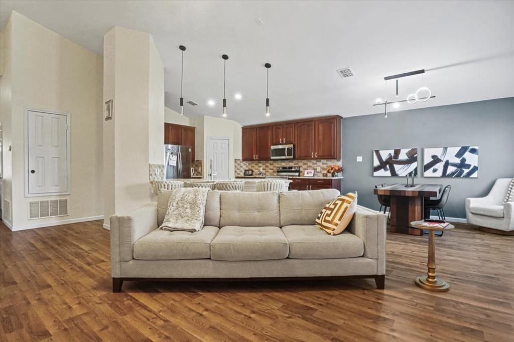 1412 Cheyenne Road Wylie, TX 75098 - Photo 6 of 24 a living room with furniture and a wooden floor
