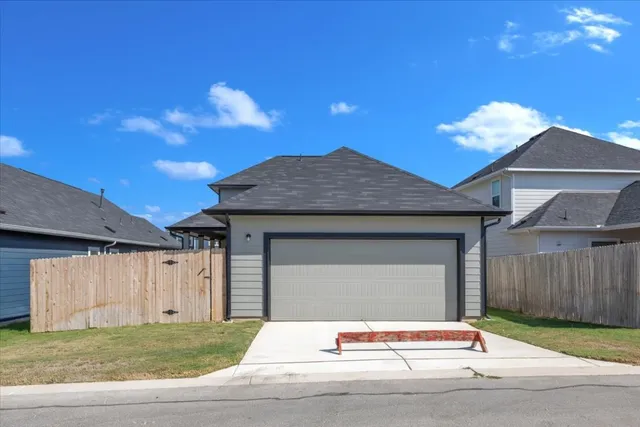 a house with a yard in front of it