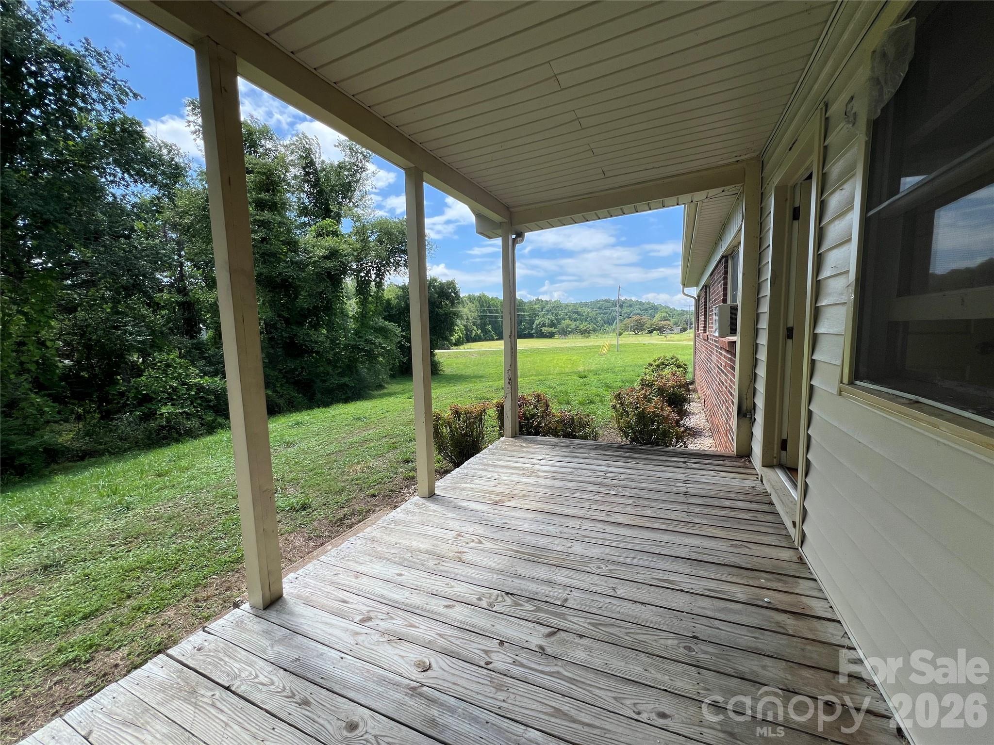 4405 Maple Creek Road Rutherfordton, NC 28139 - Photo 2 of 32 a view of a porch with wooden floor and wooden floor